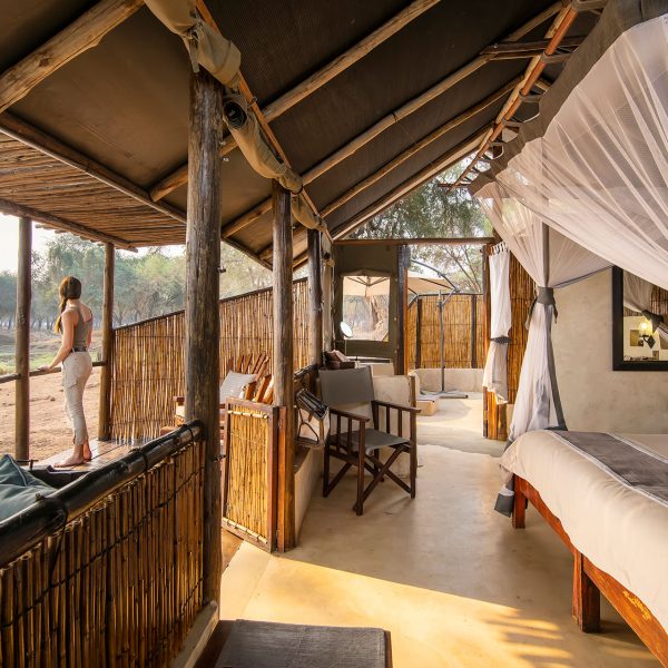 A guests watches an elephant from the comfort of her room at Old Mondoro