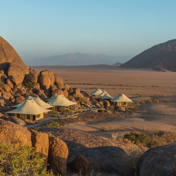 Tucked into the foot of a giant boulder strewn mountain is Boulders Camp, located in a truly remote part of the Namibrand reserve.